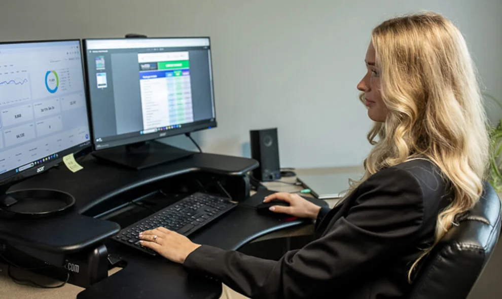 Marketing professional analyzing website analytics on dual monitors, Lancaster PA internet marketing services