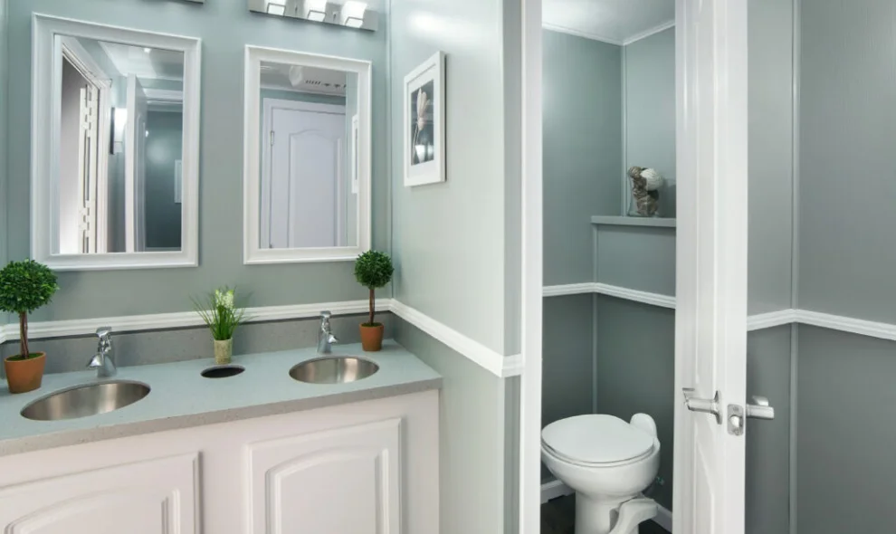 Interior of a luxury restroom trailer with double vanity and private stall, Lancaster PA wedding rentals