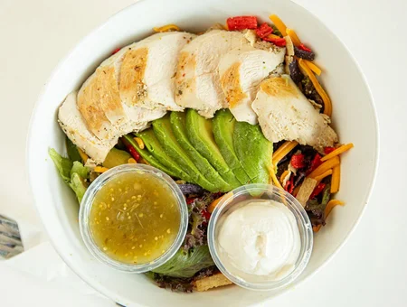 Grilled chicken avocado salad bowl with dressing at Main Street Cafe Lancaster PA