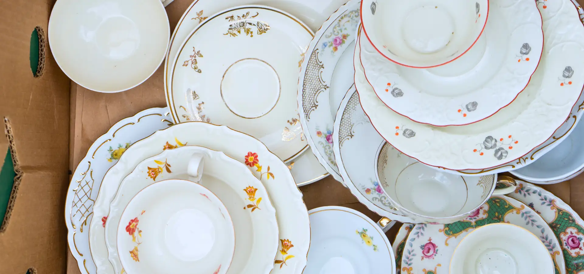 Vintage floral china plates and teacups at Roots shop in Manheim PA