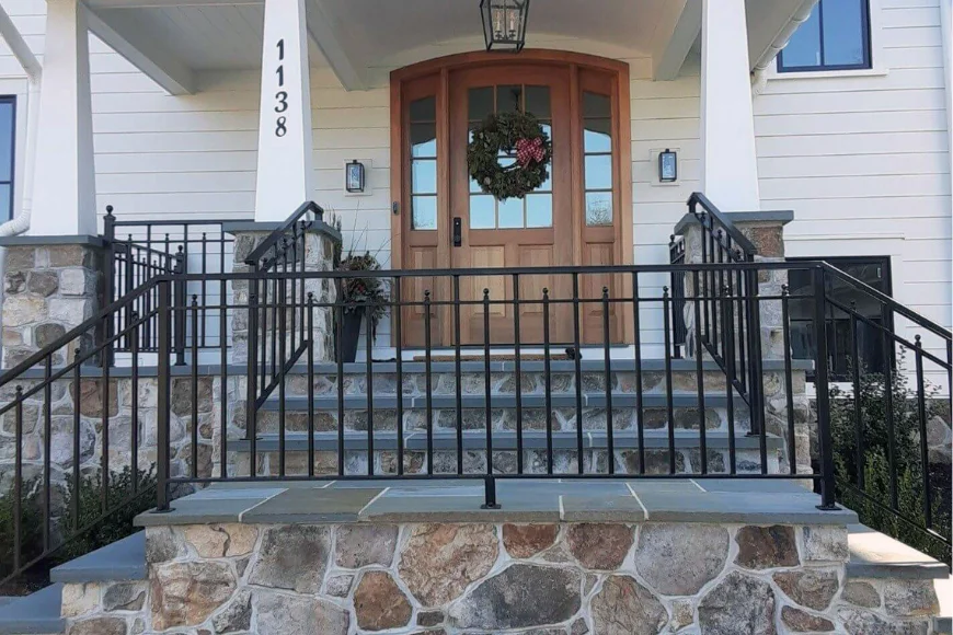 Front entrance with stone steps and railing by Maple Grove Exteriors, Lancaster PA
