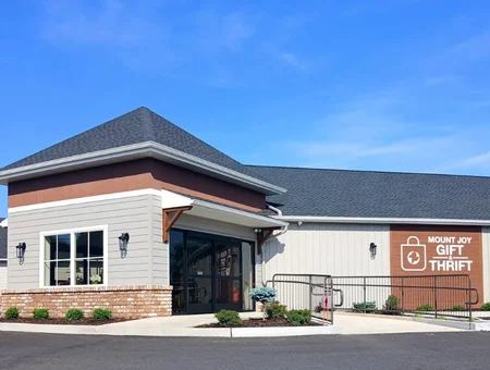 Exterior of Mount Joy Gift and Thrift store with signage and covered entrance