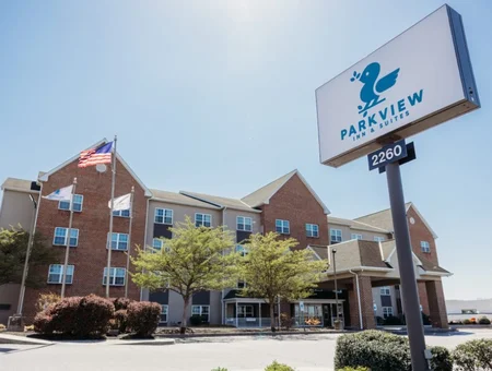 Parkview Inn and Suites exterior with sign and American flag in Lancaster PA