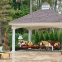 Furnished backyard pavilion with seating and dining area serviced in Lancaster County PA