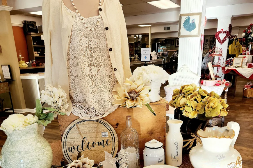 Re-Uzit Shop of New Holland store display with lace top, vases, and decorative signs, Lancaster County thrift store
