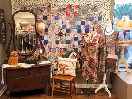 Re-Uzit Shop of New Holland vintage dresser, quilt, and dressed mannequin display, Lancaster County thrift store