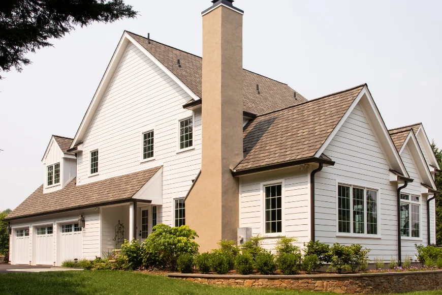 White stucco and siding home exterior remodel with attached garage by Smuckers Exterior and Remodeling in Lancaster County PA