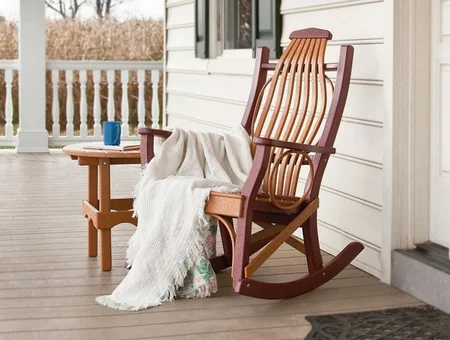 Snyder's Furniture brown rocking chair and side table on porch, Lancaster PA outdoor furniture