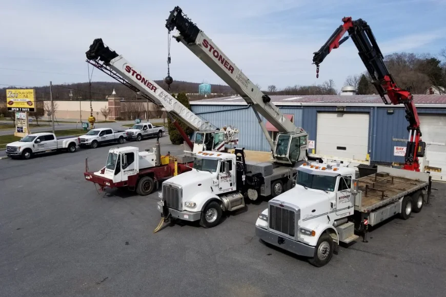 Fleet of crane trucks parked at Stoner Industrial Services yard in Lancaster PA
