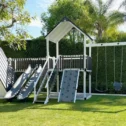 Backyard swing set with slides and playhouse from King Swings in Lancaster County PA