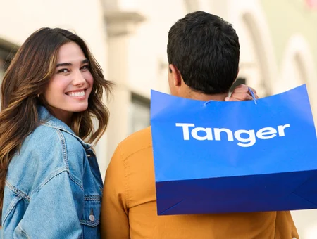 Couple walking with Tanger shopping bag, Tanger Outlets Lancaster PA