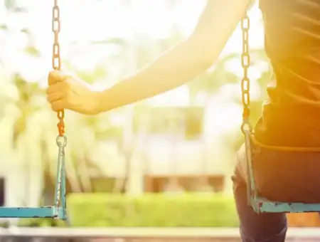 Align Pregnancy volunteer support child on playground swing in Lancaster PA
