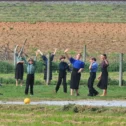 Amish schoolchildren playing kickball at recess in Lancaster County, Pennsylvania