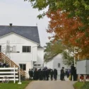 Amish wedding gathering outside farmhouse in Lancaster County, Pennsylvania