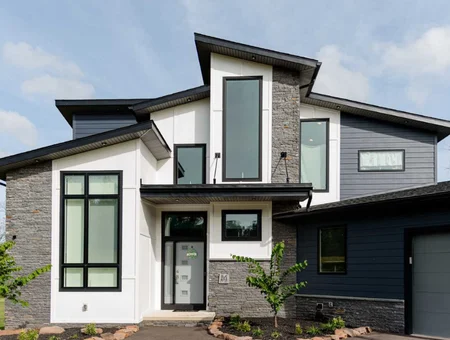 Modern two story home with stone and dark siding built by Forest Ridge Builders Lancaster PA