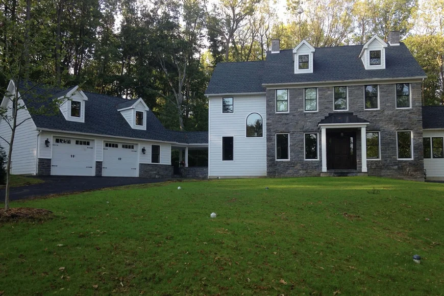 Colonial style home with stone facade and dormers built by Forest Ridge Builders Lancaster PA