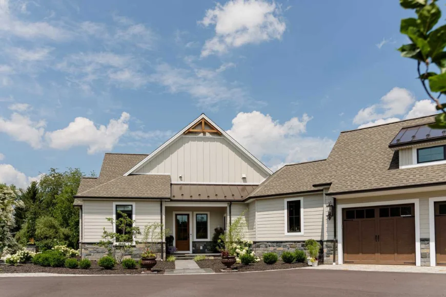 Modern farmhouse with wood garage doors built by Forest Ridge Builders Lancaster PA
