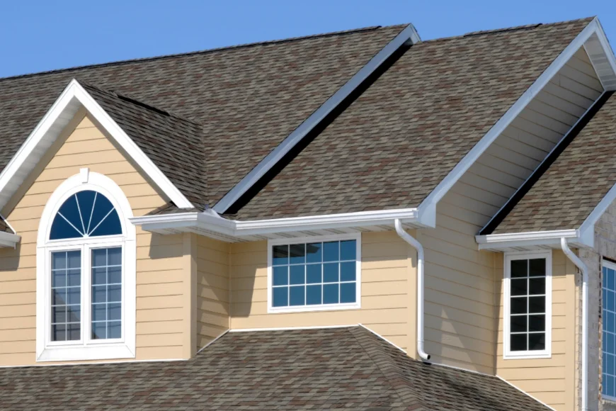 Yellow siding home with multiple gables and shingle roof by Indian Run Roofing Lancaster PA