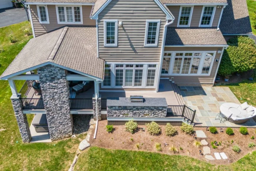 Aerial view of covered patio with stone outdoor kitchen by Smucker Brothers Construction Lancaster PA