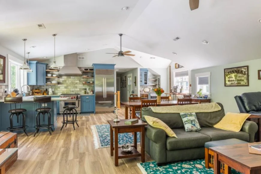 Open kitchen and living room with blue cabinets by Smucker Brothers Construction Lancaster PA